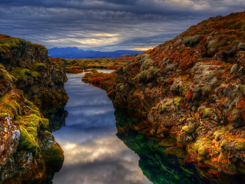 River Between Mossy Cliffs