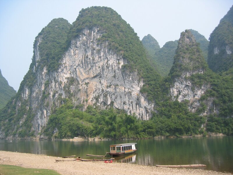 River boat near karst mountains