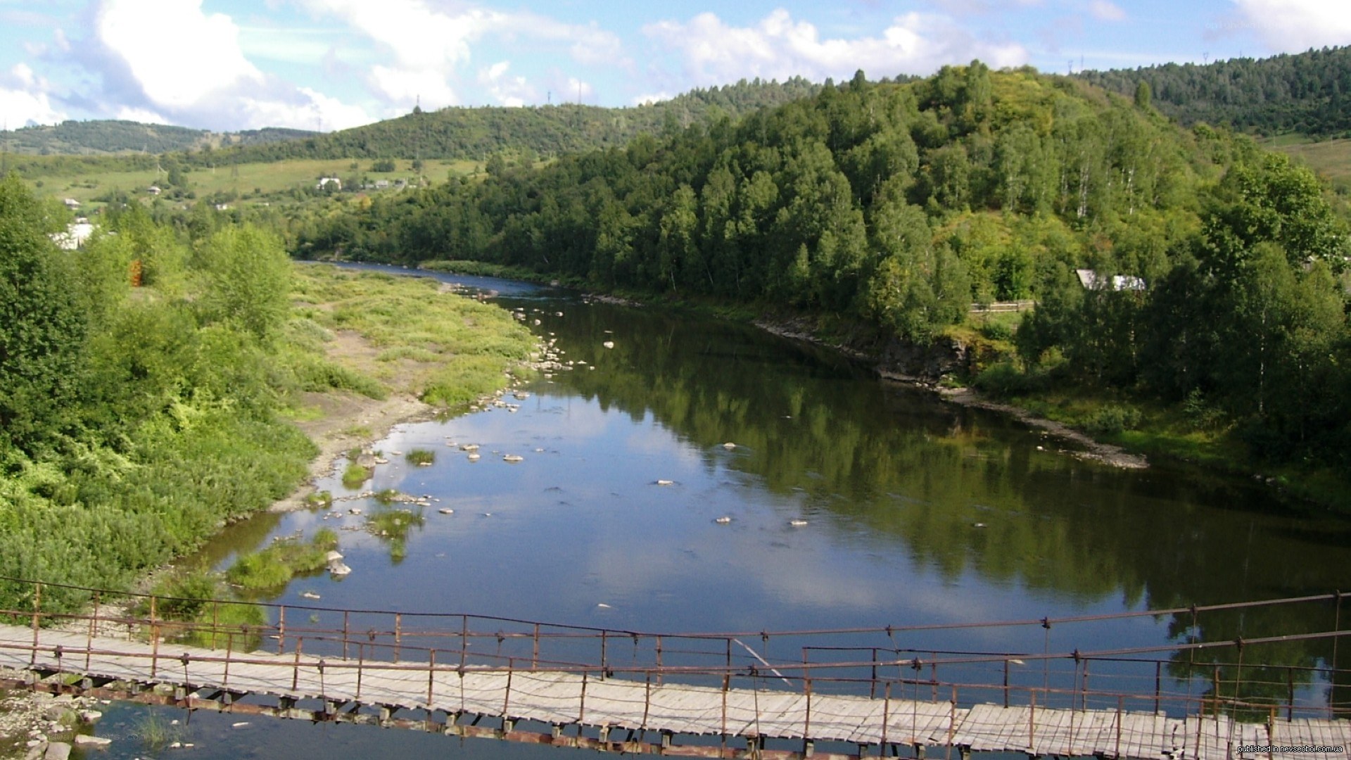 River bridge in a forested valley