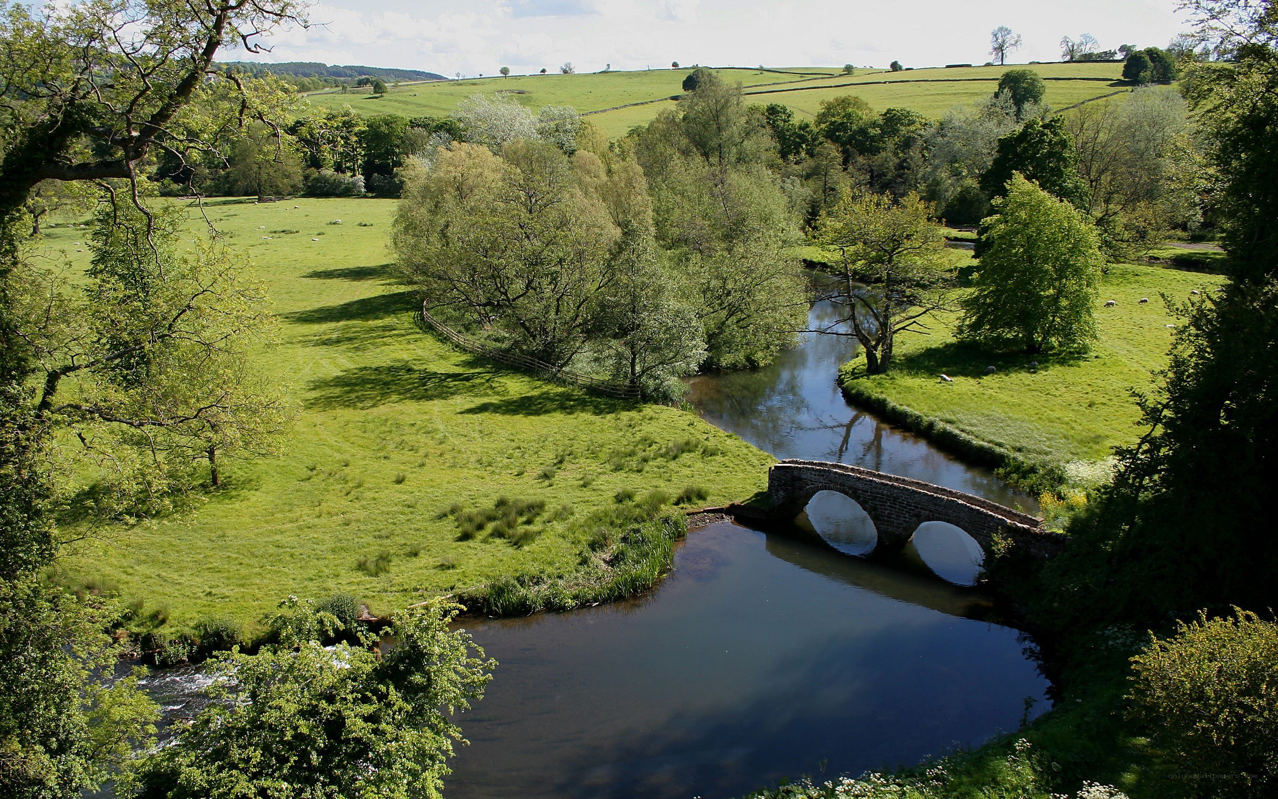 River bridge in green countryside
