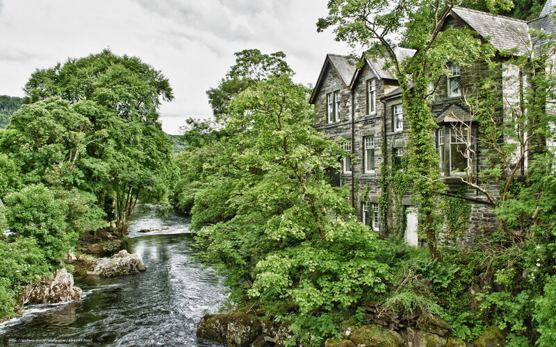 River by stone house