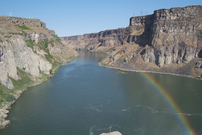 river canyon with rainbow