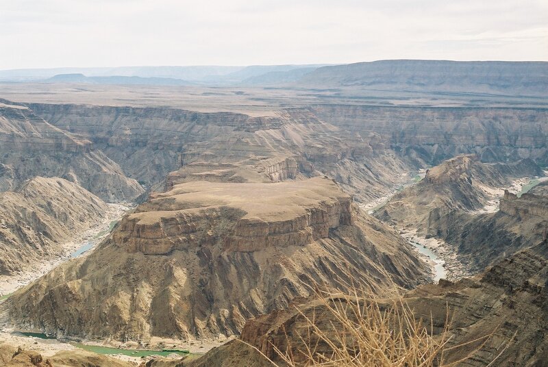 River Cutting Through Canyon — Brown