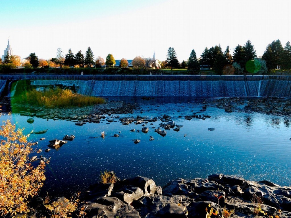 River dam with autumn foliage