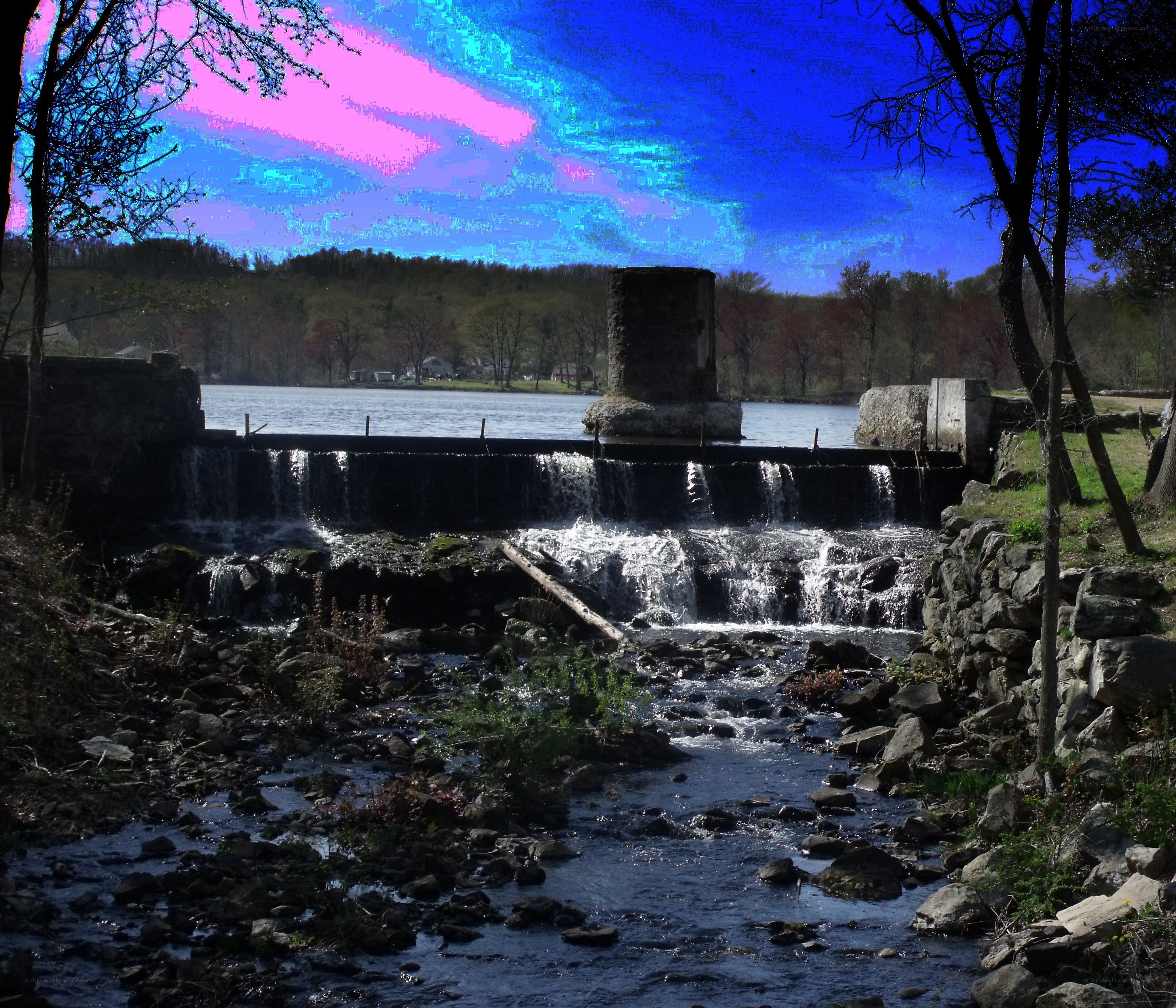 River dam with colorful sky