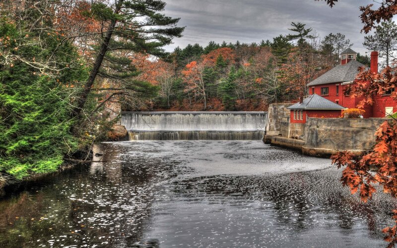 River dam with red building