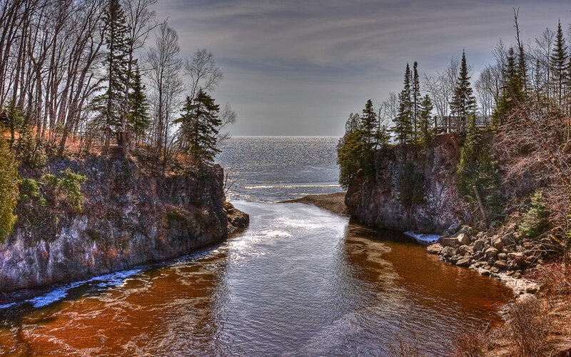 River Flowing into Ocean — Brown