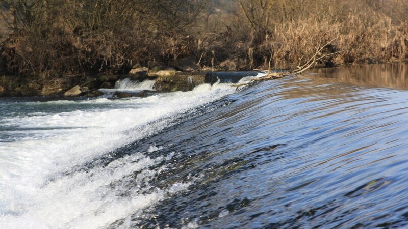 River flowing over a small dam