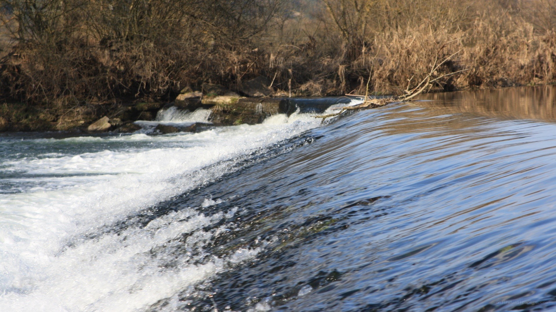 River flowing over a small dam