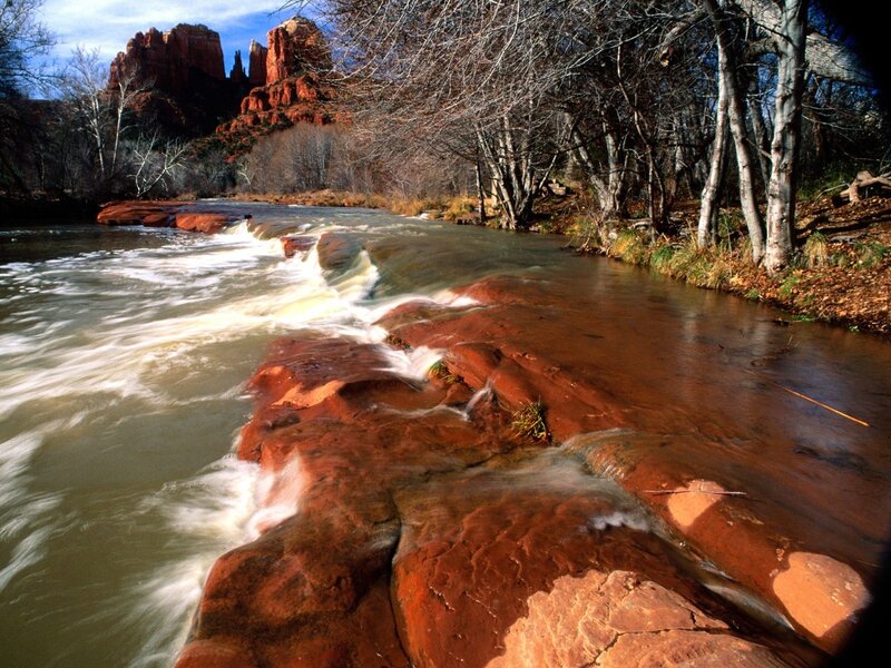 River flowing over red rocks