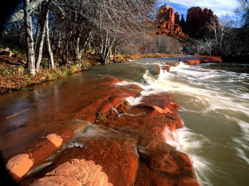 River flowing over red rocks