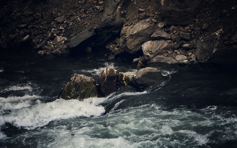 River Flowing over Rocks — Black, Dramatic, Photograph