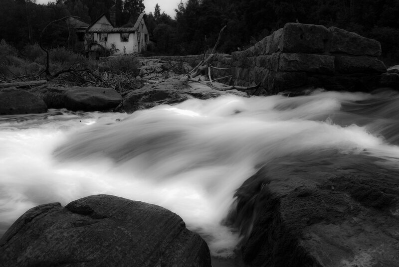 River Flowing over Rocks — Black, Dramatic