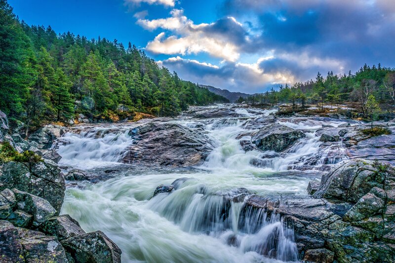River Flowing over Rocks — Blue, Dramatic, Afternoon, Photograph, Forest