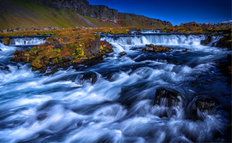 River Flowing over Rocks — Blue, Dramatic, Afternoon, Photograph
