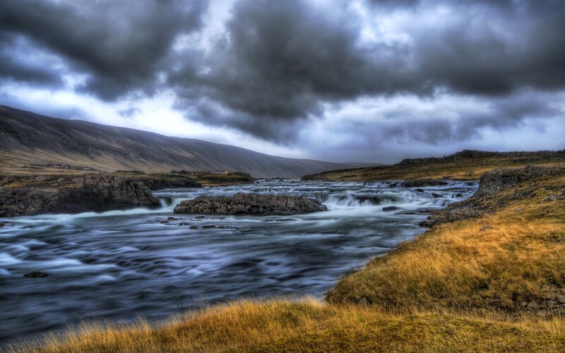 River Flowing over Rocks — Blue, Dramatic, Photograph, Mountains, Clouds