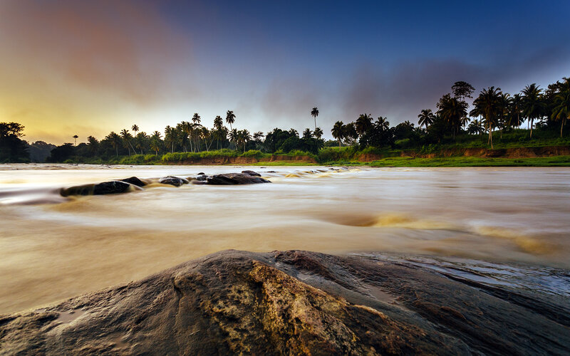 River Flowing over Rocks — Blue, Serene, Sunset