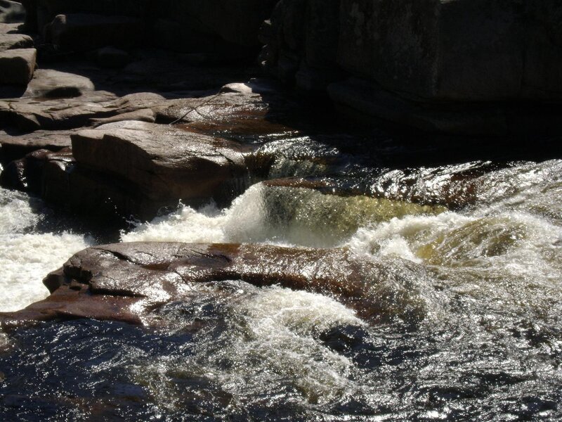 River Flowing over Rocks — Brown, Dramatic, Afternoon, Photograph