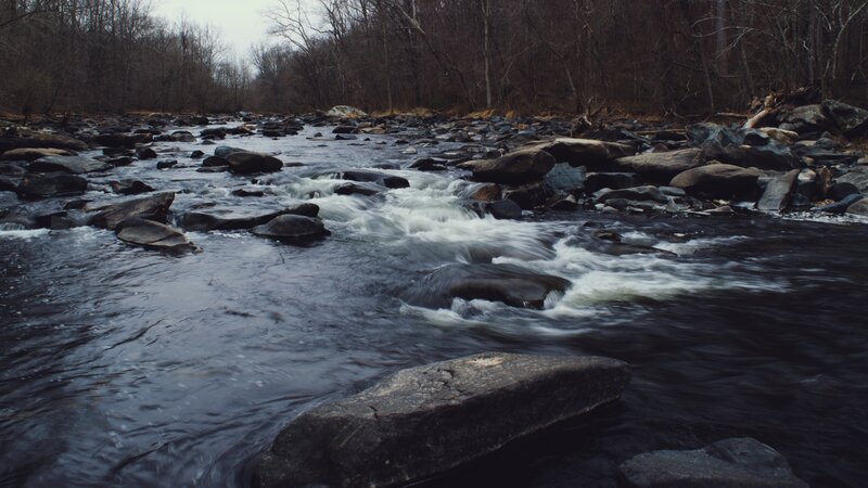 River Flowing over Rocks — Gray, Calm