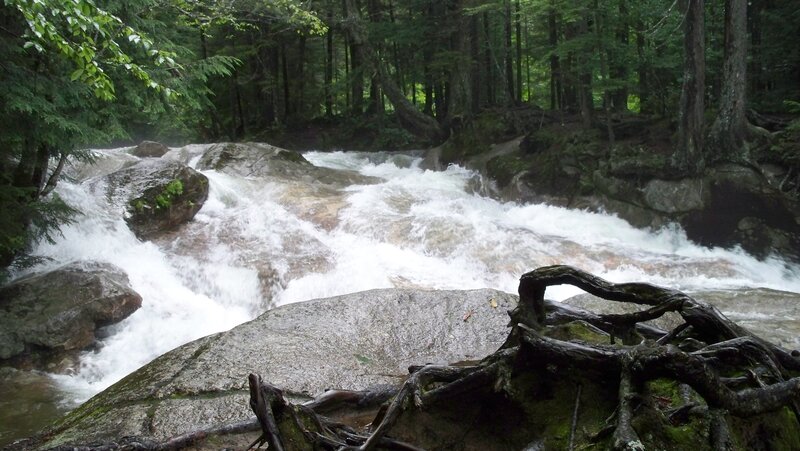 River Flowing over Rocks — Green