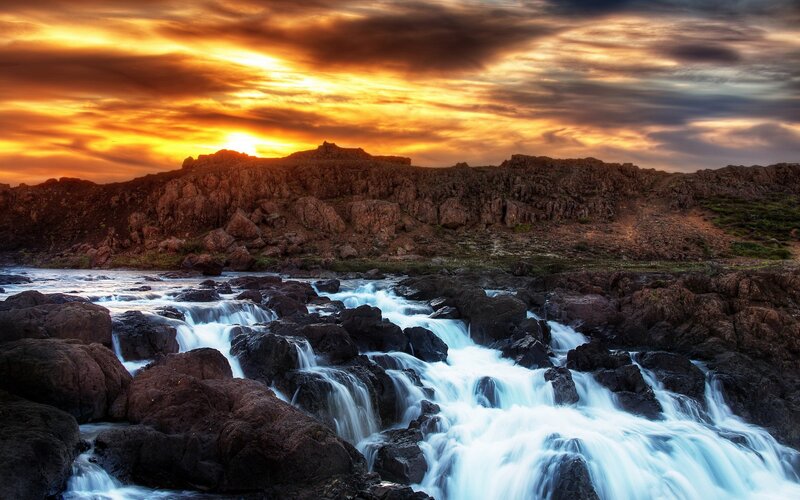 River Flowing over Rocks — Orange, Dramatic, Sunset, Photograph, Sky, Clouds
