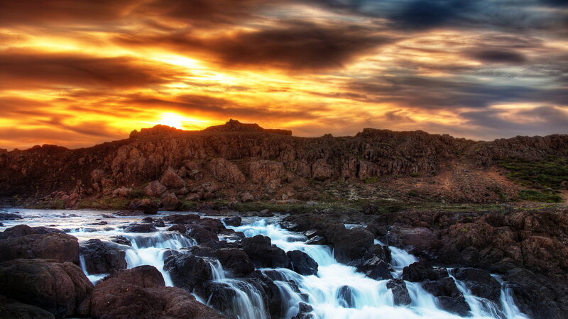 River Flowing over Rocks — Orange, Dramatic, Sunset, Photograph