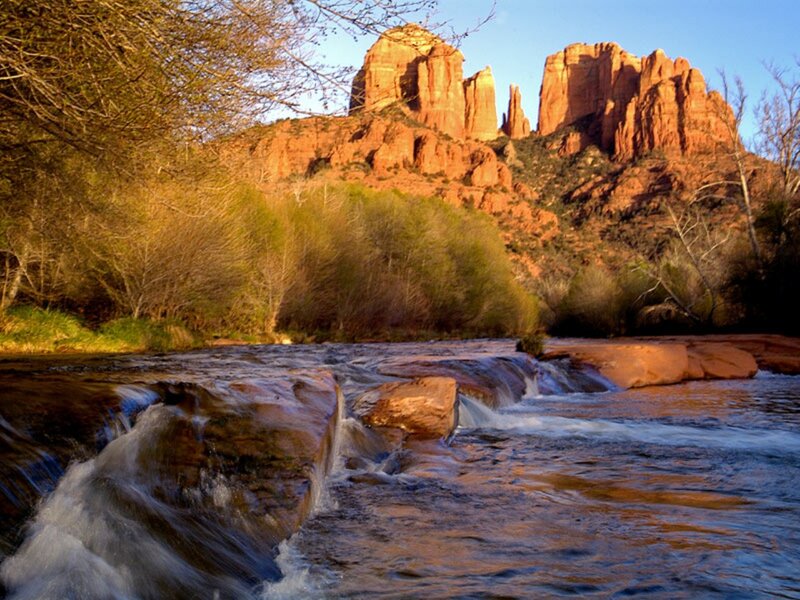 River Flowing over Rocks — Red, Serene, Sunset