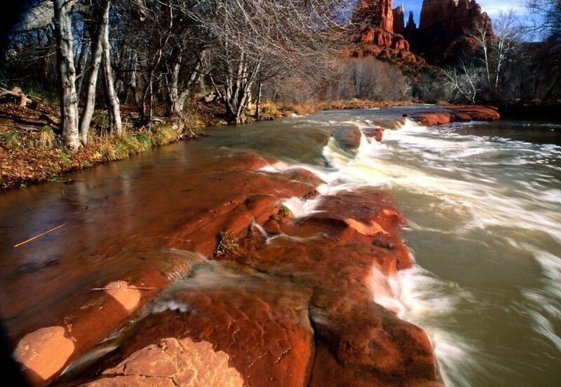 River Flowing over Rocks — Red