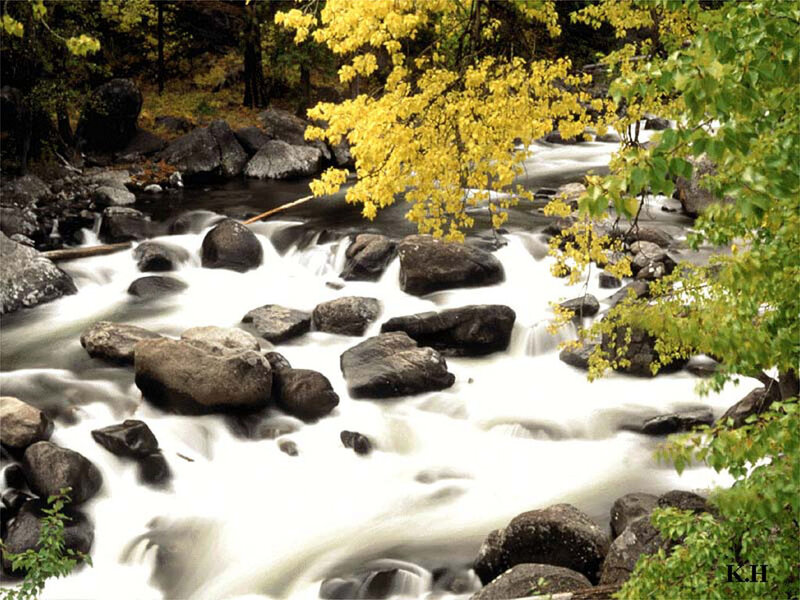 River Flowing over Rocks — Yellow