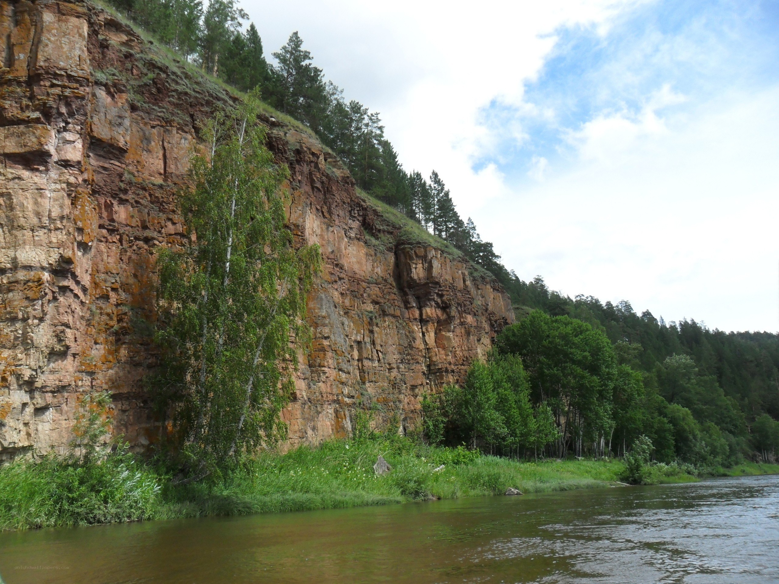 River flowing past a rocky cliff