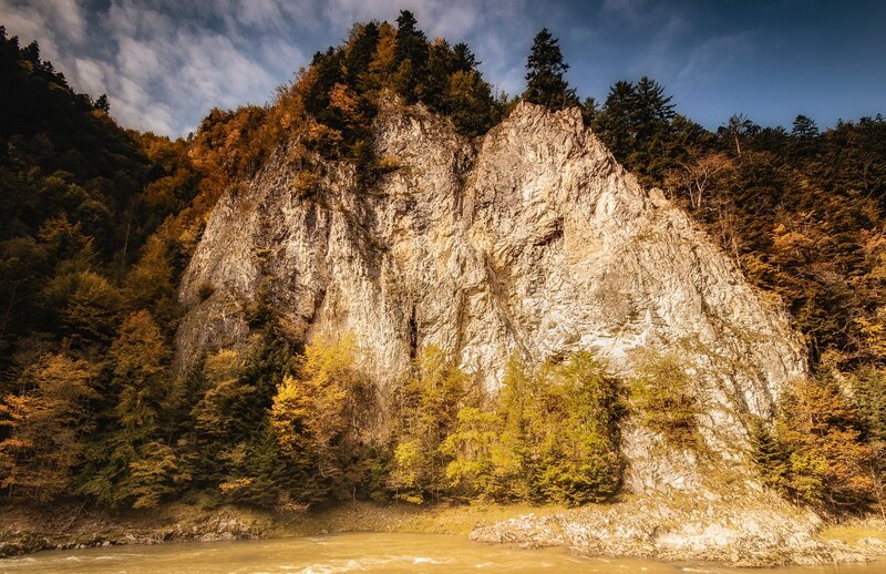 River Flowing Past Cliff