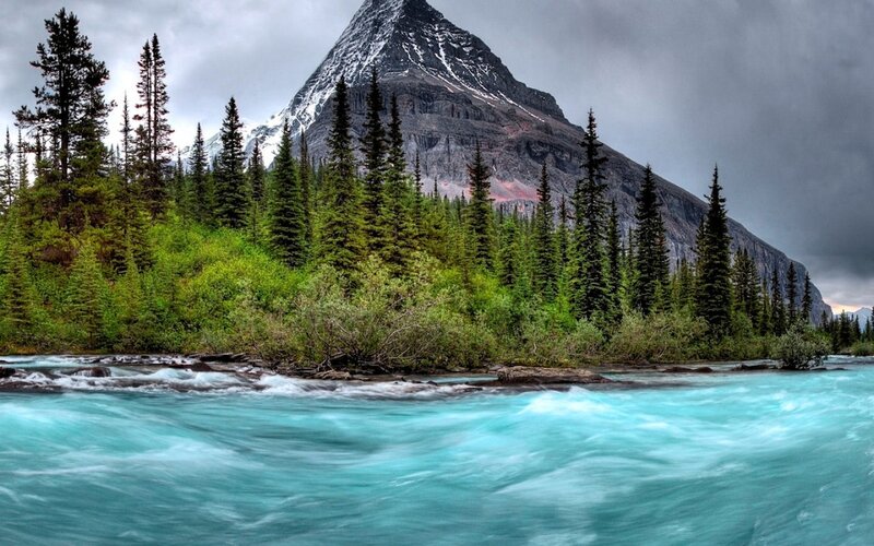 River Flowing Past Mountain — Blue, Dramatic, Photograph