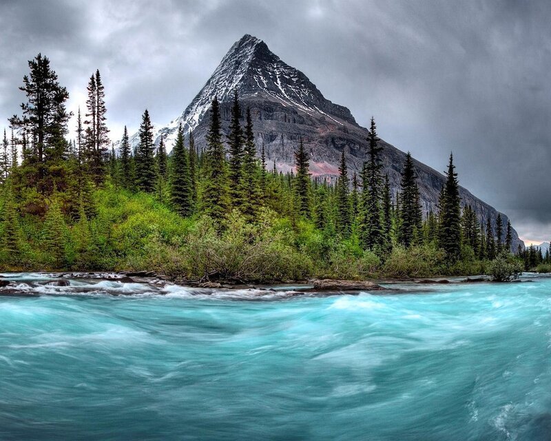 River Flowing Past Mountain