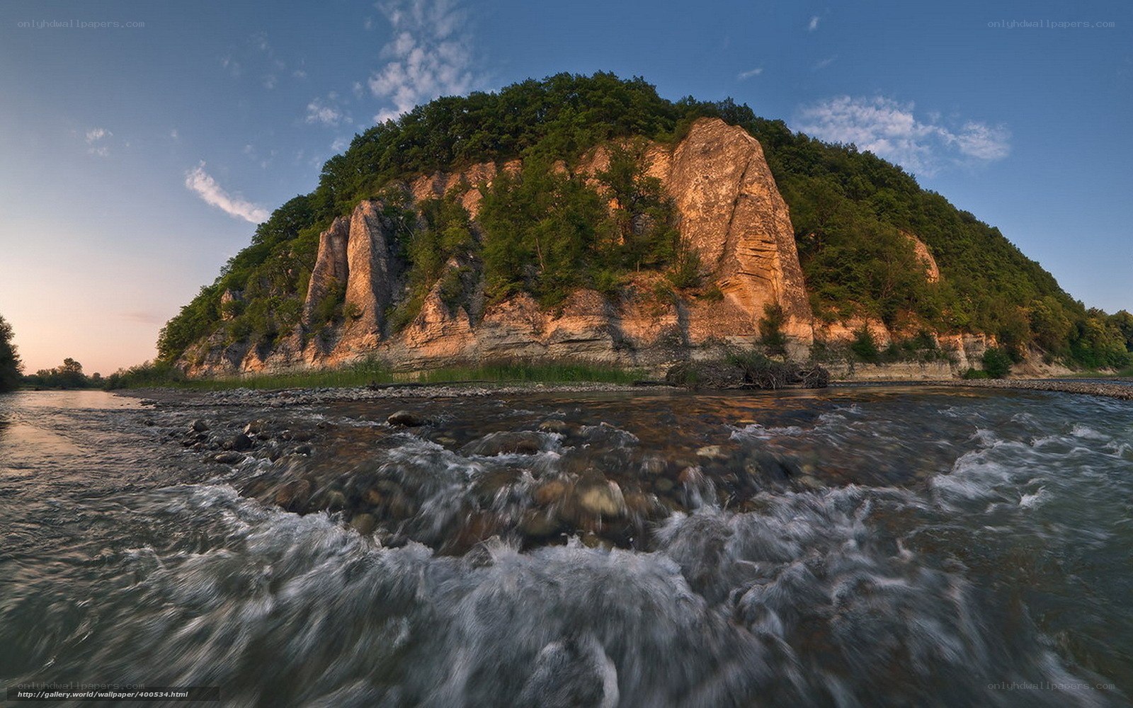 River flowing past rocky cliff