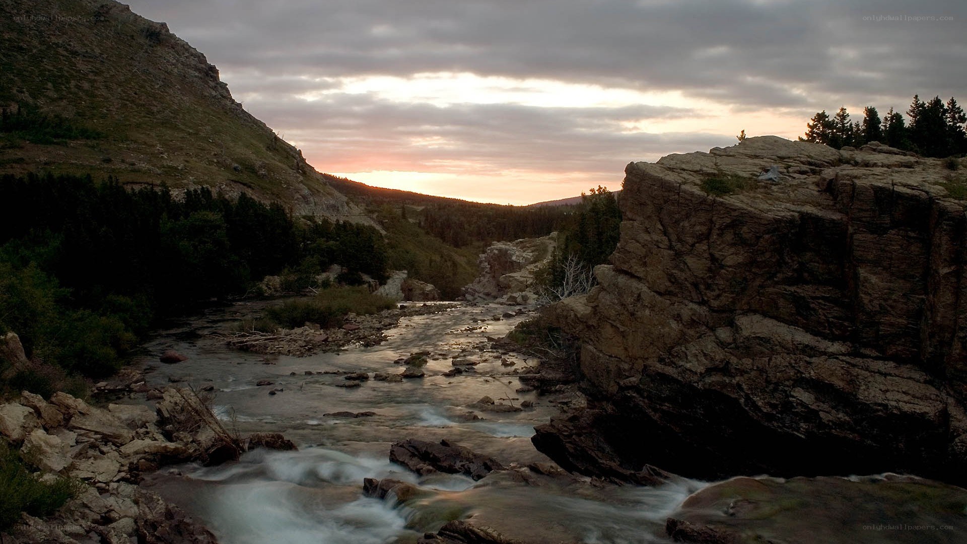 River flowing through a canyon at sunset