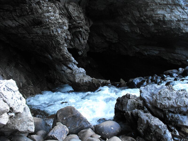 river flowing through a cave