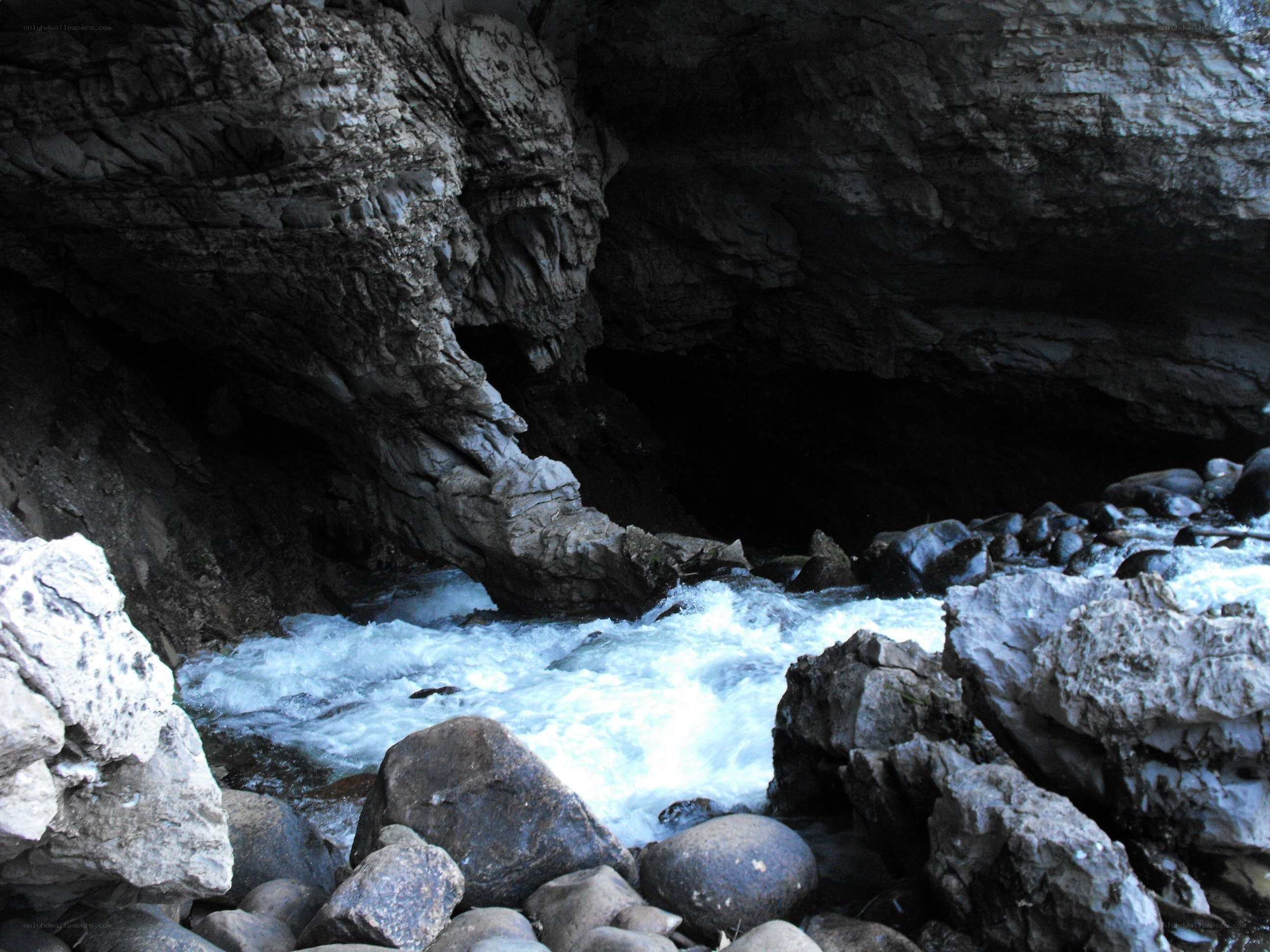 river flowing through a cave