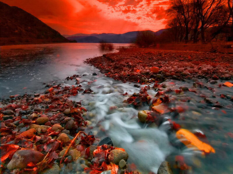 River Flowing Through Autumn Landscape — Red