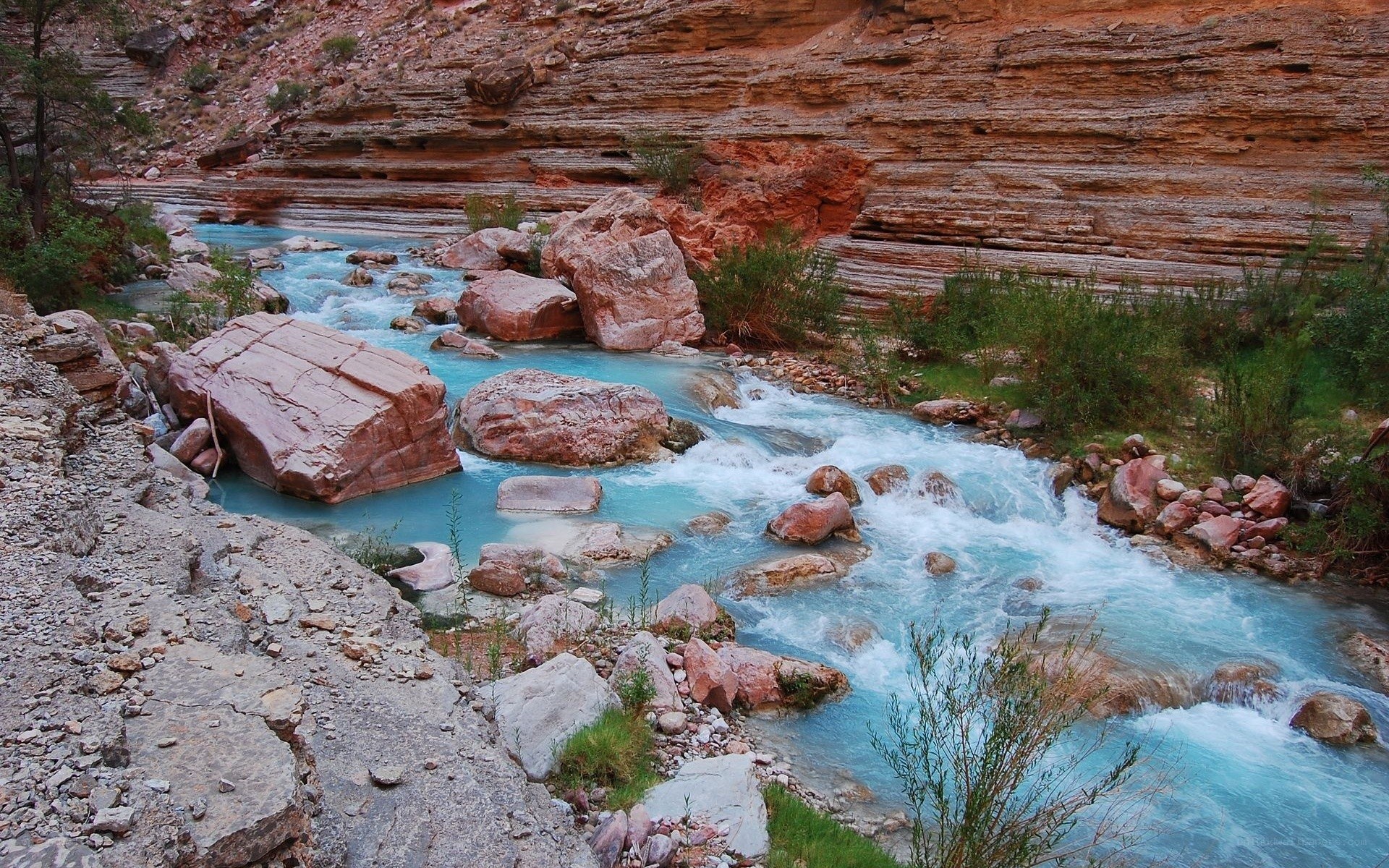 river flowing through canyon