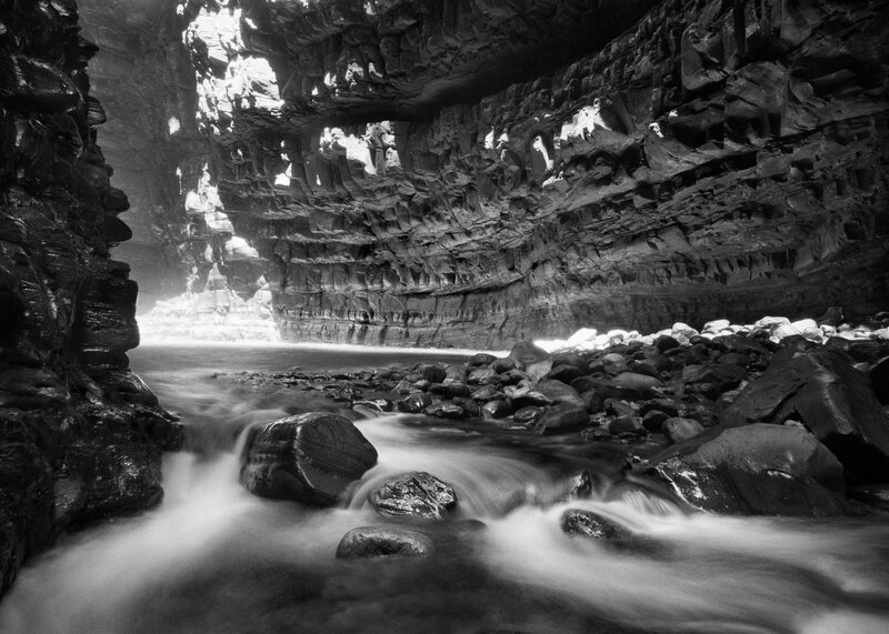 River Flowing Through Canyon — Black, Dramatic, Photograph