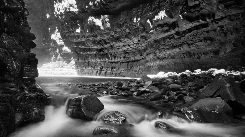 River Flowing Through Canyon — Black, Dramatic