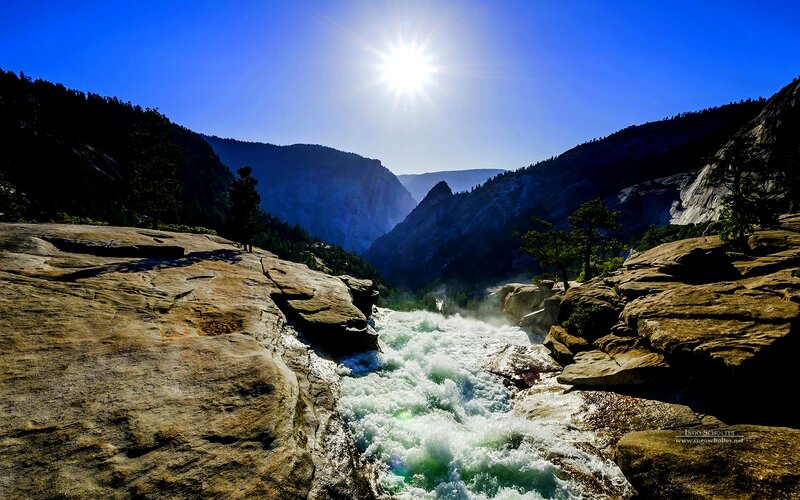 River Flowing Through Canyon — Blue, Dramatic, Afternoon, Photograph, Sun