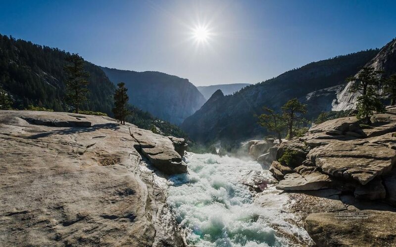 River Flowing Through Canyon — Blue, Dramatic, Afternoon, Photograph, Sun, Trees