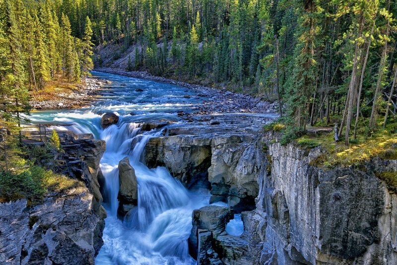 River Flowing Through Canyon — Blue, Dramatic, Afternoon, Photograph, Trees