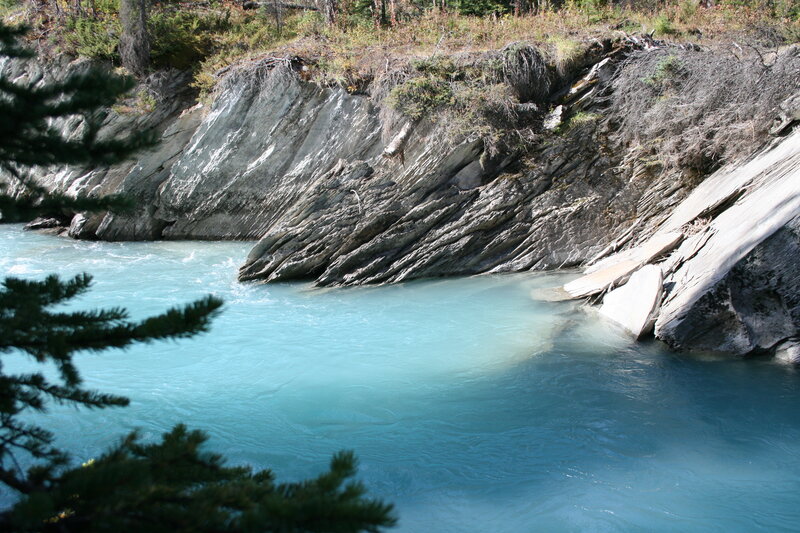 River Flowing Through Canyon — Blue, Serene, Afternoon, Photograph, Trees, Rocks, Water