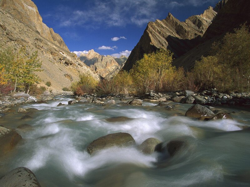 River Flowing Through Canyon — Blue, Serene, Autumn, Photograph, Mountains, Trees, Rocks