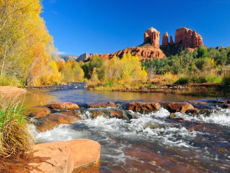River Flowing Through Canyon — Blue, Serene, Autumn, Photograph
