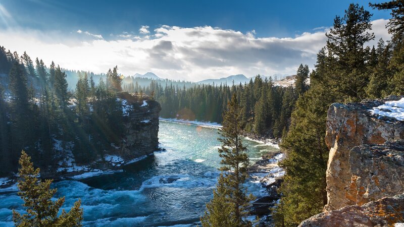 River Flowing Through Canyon — Blue, Serene, Winter, Photograph, Trees