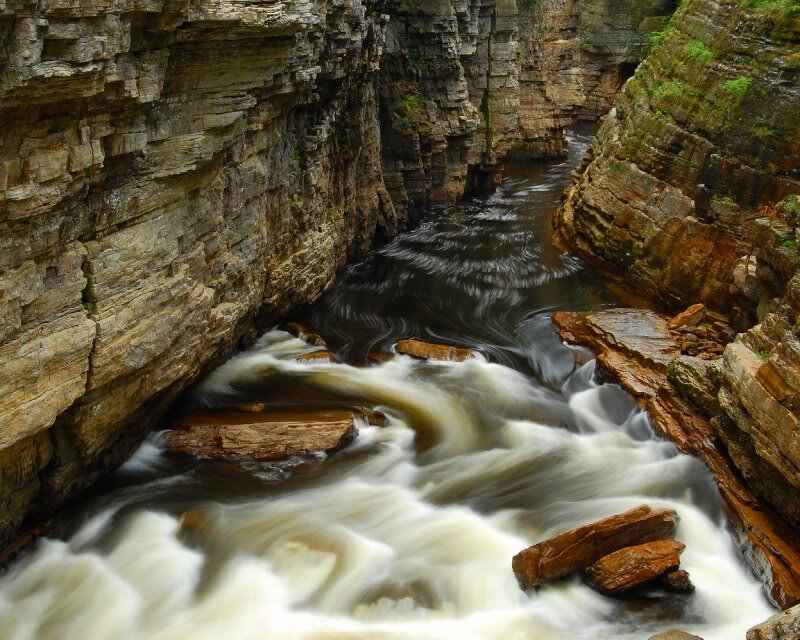 River Flowing Through Canyon — Brown, Dramatic, Photograph