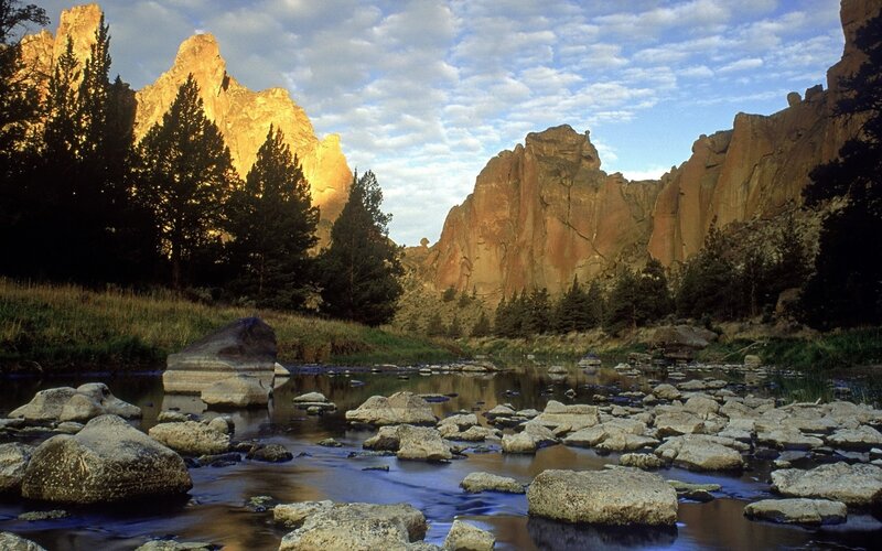 River Flowing Through Canyon — Brown, Serene, Sunset, Photograph